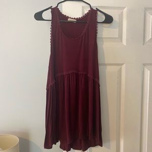 Maroon flowy tank with drop hem detail. Medium.